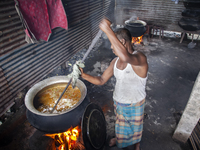 A cook prepares lunch for flood-affected people in the Aburhat area of Mirsharai Upazila, Chittagong Division, Bangladesh, on August 26, 202...