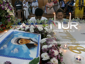 Devotees of the order founded by Saint Teresa pray by the tomb of Saint Teresa to mark her birth anniversary in Kolkata, India, on August 26...