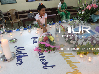 Devotees of the order founded by Saint Teresa pray by the tomb of Saint Teresa to mark her birth anniversary in Kolkata, India, on August 26...