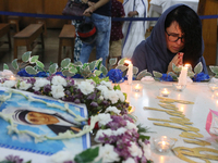 Devotees of the order founded by Saint Teresa pray by the tomb of Saint Teresa to mark her birth anniversary in Kolkata, India, on August 26...