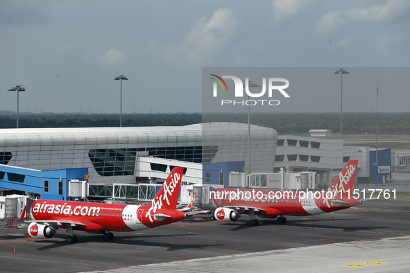 Air Asia low-cost commercial planes dock at Kuala Lumpur International Airport Terminal in Kuala Lumpur, Malaysia, on June 8, 2019. 