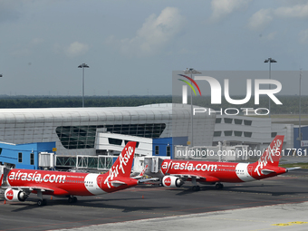 Air Asia low-cost commercial planes dock at Kuala Lumpur International Airport Terminal in Kuala Lumpur, Malaysia, on June 8, 2019. (