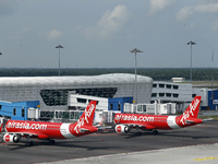 Air Asia low-cost commercial planes dock at Kuala Lumpur International Airport Terminal in Kuala Lumpur, Malaysia, on June 8, 2019. (