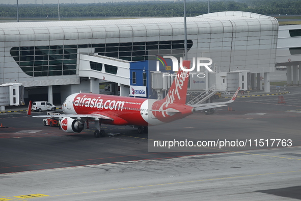 Air Asia low-cost commercial planes dock at Kuala Lumpur International Airport Terminal in Kuala Lumpur, Malaysia, on June 8, 2019. 