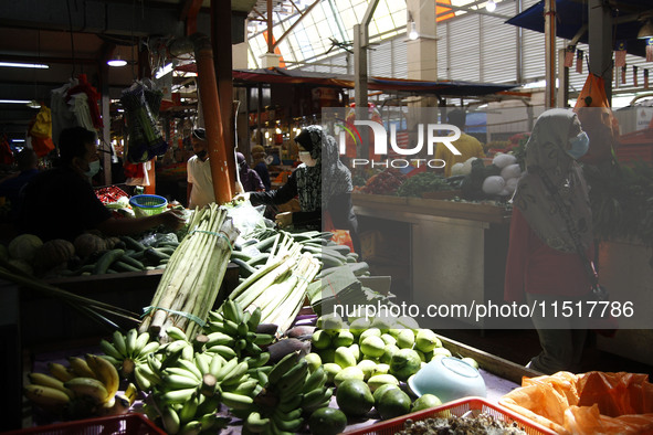 A survey of essential goods prices for the fasting month takes place at Chow Kit Market in Kuala Lumpur, Malaysia, on April 20, 2021. 