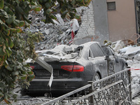 A crushed car is near a hotel destroyed by the Russian ballistic missile attack late on Monday, August 26, that claims the lives of two peop...