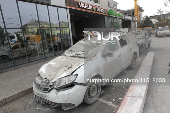 A crushed car is near a hotel destroyed by the Russian ballistic missile attack late on Monday, August 26, that claims the lives of two peop...