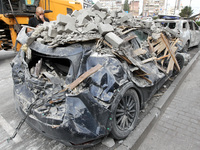 A crushed car is near a hotel destroyed by the Russian ballistic missile attack late on Monday, August 26, that claims the lives of two peop...