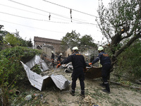 Workers of the Kobra emergency and rescue service remove the rubble at a house destroyed after a Russian Shahed drone falls onto a residenti...