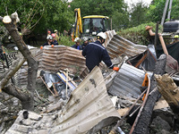 Workers of the Kobra emergency and rescue service remove the rubble at a house destroyed after a Russian Shahed drone falls onto a residenti...