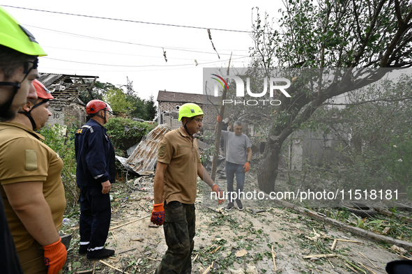 Workers of the Kobra emergency and rescue service remove the rubble at a house destroyed after a Russian Shahed drone falls onto a residenti...