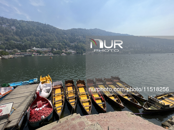 Boats moor along Naini Lake (Naini Tal) in Nainital, Uttarakhand, India, on April 21, 2024. 