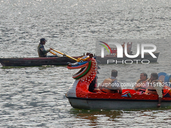 Indian tourists paddle boat along Naini Lake in Nainital, Uttarakhand, India, on April 21, 2024. (