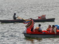 Indian tourists paddle boat along Naini Lake in Nainital, Uttarakhand, India, on April 21, 2024. (