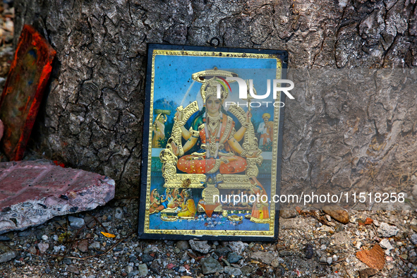 A picture of a Hindu Goddess at a small shrine along the shore of Naini Lake in Nainital, Uttarakhand, India, on April 21, 2024. 