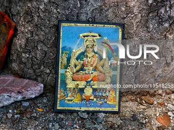 A picture of a Hindu Goddess at a small shrine along the shore of Naini Lake in Nainital, Uttarakhand, India, on April 21, 2024. (