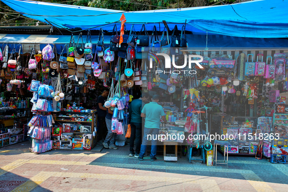 Shops line the footpath in Nainital, Uttarakhand, India, on April 21, 2024. 