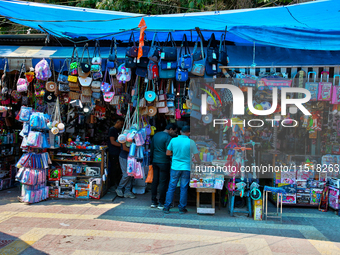 Shops line the footpath in Nainital, Uttarakhand, India, on April 21, 2024. (