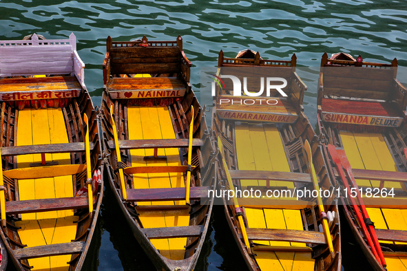 Boats moor along Naini Lake (Naini Tal) in Nainital, Uttarakhand, India, on April 21, 2024. 