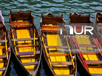 Boats moor along Naini Lake (Naini Tal) in Nainital, Uttarakhand, India, on April 21, 2024. (