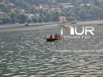 Boats are along Naini Lake (Naini Tal) in Nainital, Uttarakhand, India, on April 21, 2024. (