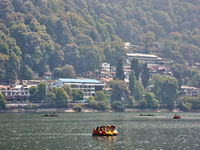 Indian tourists paddle boat along Naini Lake in Nainital, Uttarakhand, India, on April 21, 2024. (