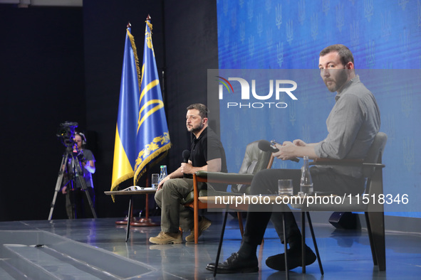 President of Ukraine Volodymyr Zelenskyy and press secretary of the President of Ukraine Serhiy Nykyforov attend a news conference during th...