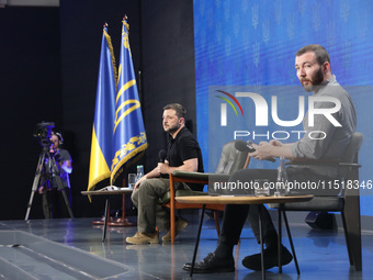 President of Ukraine Volodymyr Zelenskyy and press secretary of the President of Ukraine Serhiy Nykyforov attend a news conference during th...