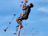 Youths participate in the Dadhi-Kando game organized at Paghalupara near Sahudangi on the outskirts of Siliguri, India, on August 27, 2024,...