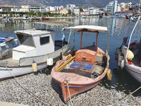 Ecological disaster in Greece with large amount of dead fish wash-up on the beach, shores, port of Volos city and the Pagasetic Gulf spreadi...