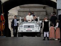 Pope Francis arrives in St. Peter's Square to lead the weekly General Audience in Vatican City on August 28, 2024. (