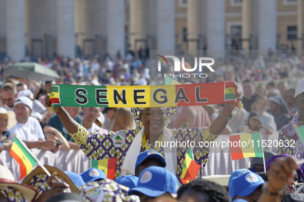 A pilgrim from Senegal attends Pope Francis's weekly general audience in Saint Peter's Square, Vatican City, on August 28, 2024. 