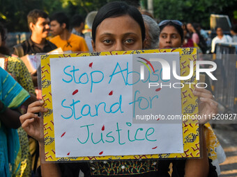 Citizens participate in a protest rally in Kolkata, India, on August 28, 2024, against the rape and murder of a second-year PGT doctor at RG...