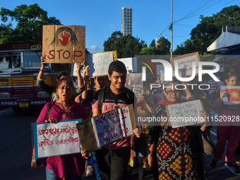 Citizens participate in a protest rally in Kolkata, India, on August 28, 2024, against the rape and murder of a second-year PGT doctor at RG...