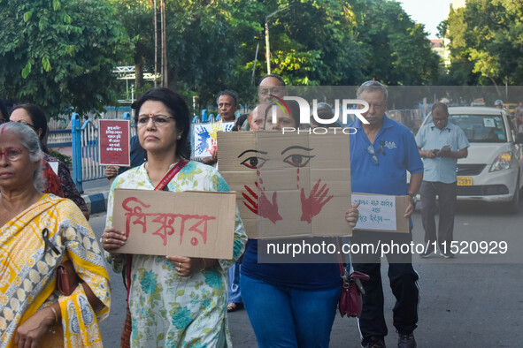 Citizens participate in a protest rally in Kolkata, India, on August 28, 2024, against the rape and murder of a second-year PGT doctor at RG...