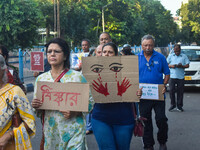 Citizens participate in a protest rally in Kolkata, India, on August 28, 2024, against the rape and murder of a second-year PGT doctor at RG...