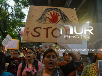 Citizens participate in a protest rally in Kolkata, India, on August 28, 2024, against the rape and murder of a second-year PGT doctor at RG...