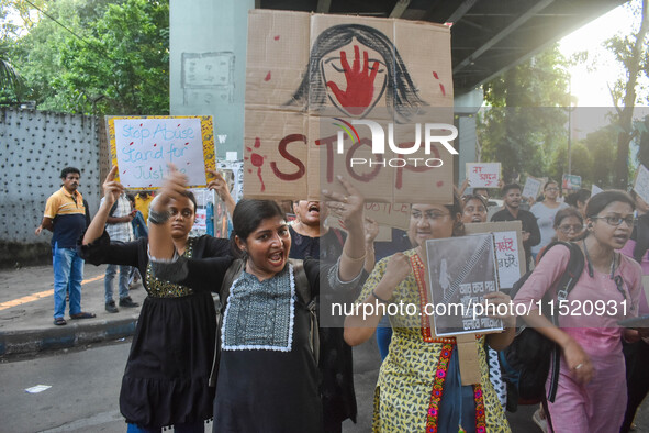 Citizens participate in a protest rally in Kolkata, India, on August 28, 2024, against the rape and murder of a second-year PGT doctor at RG...