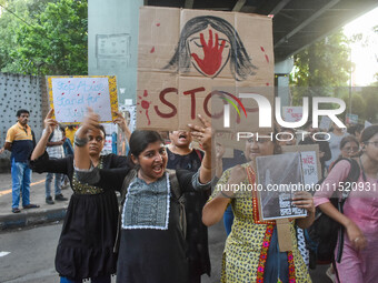 Citizens participate in a protest rally in Kolkata, India, on August 28, 2024, against the rape and murder of a second-year PGT doctor at RG...