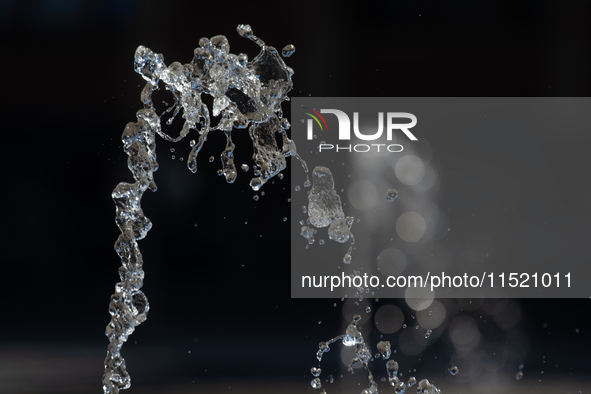 Water from a fountain is seen at Harry Blum Square in Cologne, Germany, on August 28, 2024. 