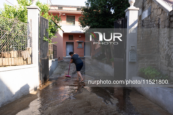 The residents of San Felice a Cancello, in the province of Caserta, deal with the aftermath of the mudslide and water that pour into the tow...