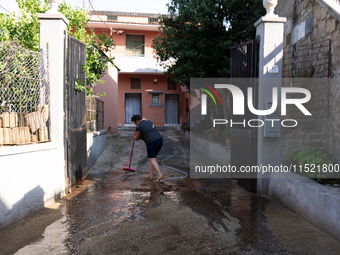 The residents of San Felice a Cancello, in the province of Caserta, deal with the aftermath of the mudslide and water that pour into the tow...