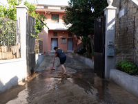 The residents of San Felice a Cancello, in the province of Caserta, deal with the aftermath of the mudslide and water that pour into the tow...