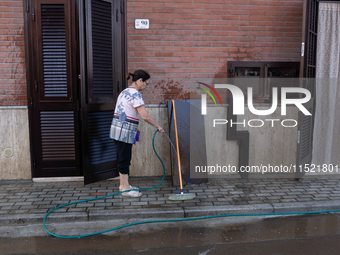 The residents of San Felice a Cancello, in the province of Caserta, deal with the aftermath of the mudslide and water that pour into the tow...