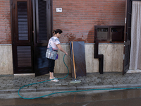 The residents of San Felice a Cancello, in the province of Caserta, deal with the aftermath of the mudslide and water that pour into the tow...