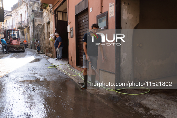 The residents of San Felice a Cancello, in the province of Caserta, deal with the aftermath of the mudslide and water that pour into the tow...