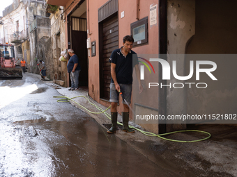 The residents of San Felice a Cancello, in the province of Caserta, deal with the aftermath of the mudslide and water that pour into the tow...