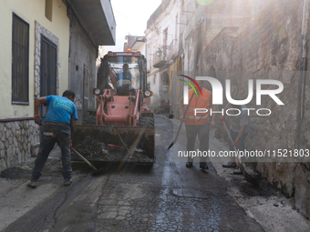 The residents of San Felice a Cancello, in the province of Caserta, deal with the aftermath of the mudslide and water that pour into the tow...