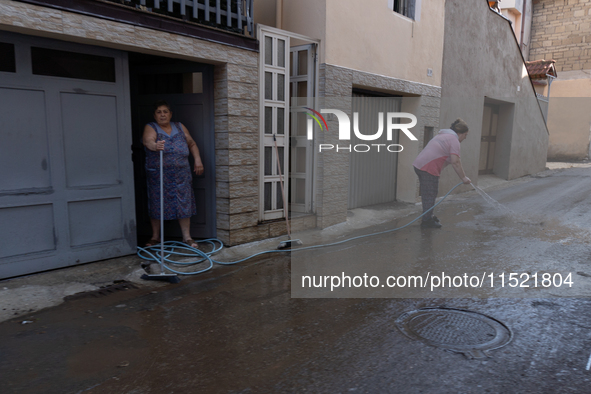 The residents of San Felice a Cancello, in the province of Caserta, deal with the aftermath of the mudslide and water that pour into the tow...