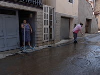 The residents of San Felice a Cancello, in the province of Caserta, deal with the aftermath of the mudslide and water that pour into the tow...